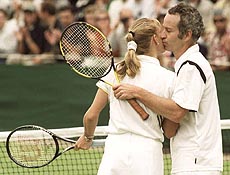 Former champions Steffi Graf and John McEnroe embrace at the end of their Mixed Doubles match at Wimbledon on Wednesday. The two former champions teamed up to play against Eyal Ran from Israel and Vanessa Menga, of Brazil. McEnroe and Graf won the match 6-3, 6-4. AP/PTI