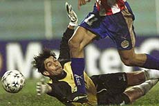 Peru's goalkeeper Oscar Ibanez can't stop Paraguay's Roque Santacruz from scoring his team's only goal in an America's Cup Group C game in Pedro Juan Caballero, Paraguay, Monday 