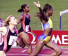 Merlene Ottey from Jamaica (right) wins the 100 meter race ahead of two unidentified runners at the International Track and Field Meeting in Lucerne, Switzerland, on Monday 