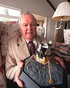 Tom Kelly, holds a model of the lunar module used during the Apollo 11 mission. Kelly headed the team of nearly 3,000 engineers who created the lunar module that placed man on the moon and got him off again. 