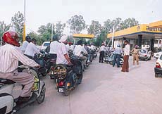 Long queues outside a petrol pump in the wake of petrol dealers reported refusal to indent new supplies in Chandigarh on Tuesday