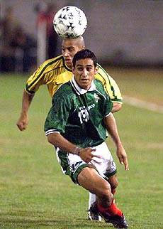 Brazil's Roberto Carlos (back) heads the ball before Mexico's Miguel Cepeda during an America's Cup semifinal game in Ciudad del Este, Paraguay, on Wednesday