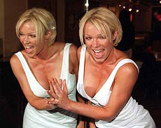 Model Nell McAndrew, who has the face and body of Laura Croft, heroine of the computer game, Tomb Raider, poses during a photocall in London on Thursday,