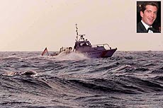 A US Coast Guard vessel searches the waters of Vineyard Sound near Gayhead lighthouse off Martha’s Vineyard on Saturday evening. 