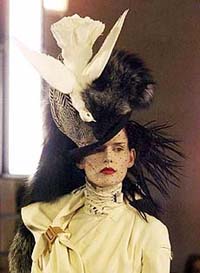 A model sports a hat with a bird designed by John Galliano during the Christian Dior Haute Couture fall-winter 1999/2000 collection presentation in Versailles, southwest of Paris, on Monday