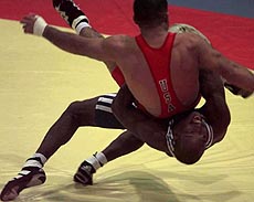 Cuba's Luibal Colas flips the United State's David Zuniga in Pan American greco wrestling competition in the 69kg weight class on Saturday
