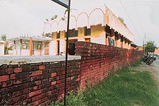 A part of the wall, allegedly constructed by the management of the Sector 23 Prachin Shiv Mandir, violating building norms