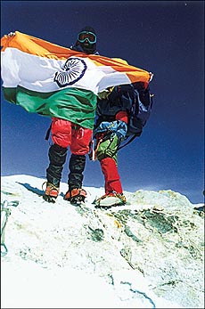 Boys unfurling the Tricolour atop Leo Parigyal. 