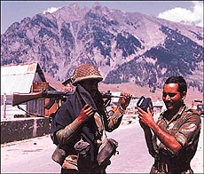 Jawans take a break from duty and listen to battle news