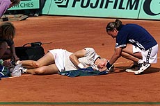 Natasha Zvereva of Belarus kneels next to her teammate Jana Novotna.