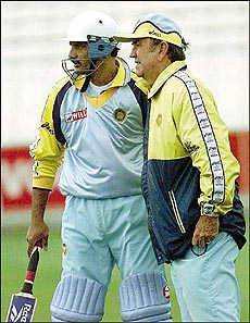 India's cricket captain Mohammad Azharuddin listens to his team's Australian trainer Bobby Simpson during India's training session at London's Oval on Thursday