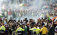 Jubilant Indian fans are scattered by fireworks