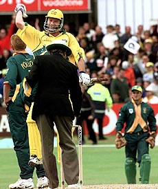 Australia's cricket captain Steve Waugh celebrates his teams win over South Africa in the Cricket World Cup in the Leed's Headingley cricket ground on Sunday