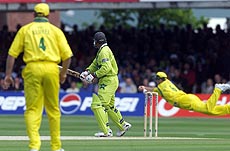 Pakistan's opening batsman Wajahatullah Wasti is out by a diving catch at second slip by Australia's Mark Waugh in the Cricket World Cup final at Lords in London 20 June 1999