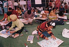 Children participate in the on-the-spot painting contest held at the Rose garden, Sector 16, on Sunday