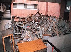 Broken furniture lying in the corridor of the Law Department of Panjab University.