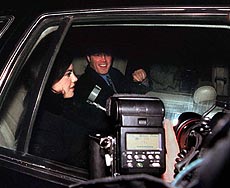   NEW YORK : Monica Lewinsky and Andrew Morton, author of 'Monica's Story," are surrounded by photographers as they leave New York's 21 Club restaurant in a limousine on Friday. They were celebrating the publication of Morton's book about Lewinsky, released earlier in the week. AP/PTI