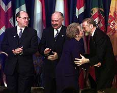 Secretary of State Madeleine Albright greets Polish Foreign Minister Bronislaw Geremek (right) along with Czech Republic Foreign Minister Jan Kavan (left) and Hungarian Foreign Minister Janos Martonyi (second from left) at the Harry S. Truman Library in Independence, Mo. Albright accepted admission papers from the foreign ministers, marking their countries' formal entry into the 50-year-old NATO alliance. 