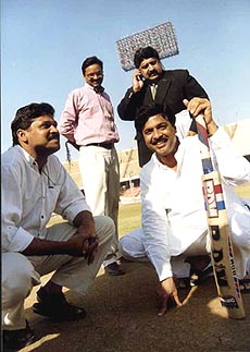 Union Minister for Information and Broadcasting, Pramod Mahajan, inspecting the pitch at Jawaharlal Nehru stadium in New Delhi on Wednesday, where the day-and-night cricket match will be played to mark the launching of DD Sports channel on 18th March, 1999 