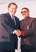 French Ambassador to India Claude Blanchemaison shakes hand with Manmohan Lal Sareen 
