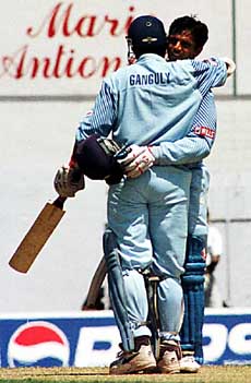 India's Rahul Dravid (facing camera) who scored a century, gets a hug from teammate Saurav Ganguly