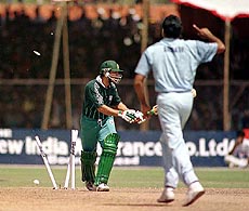Pakistan's Moin Khan being bowled by Srinath during the triangular one day cricket match between India and Pakistan at Swai Mansingh stadium in Jaipur on Wednesday 