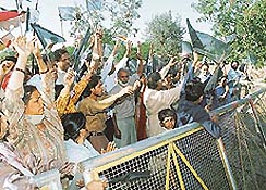 Protesters raise slogans against the blocking of the entrance from the front side to a temple at Sector 31 in Chandigarh on Friday