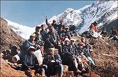 A group of trekkers sitting near the glacier
