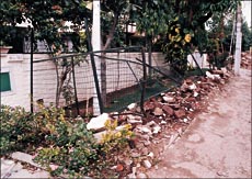 An illegally raised fence demolished by enforcement staff of HUDA in Sector 6 of Panchkula on Monday.