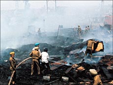 Firemen extinguish the fire which broke out in Phase ii of Industrial Area, Chandigarh, on Monday