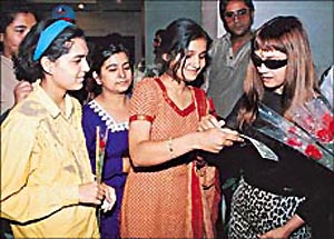 Indi pop-queen Alisha Chinai surrounded by autograph hunters at a hotel in Chandigarh on Tuesday.