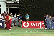 The Zimbabwean and Indian cricket teams observe a minutes silence in respect of the death of Sachin Tendulkar's father, before the start of their match at Grace Road in Leicester on Wednesday