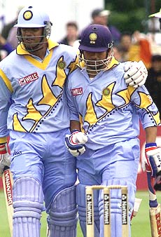 Rahul Dravid  congratulates India's Sachin Tendulkar