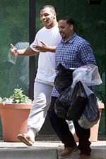    ROCKVILLE, USA : Former heavyweight champion Mike Tyson gestures while leaving the Montgomery County, Md. Correction Facility in Rockville, on Monday. Tyson was released from the prison, hours after an Indiana judge's officed announced Tyson probation has ended