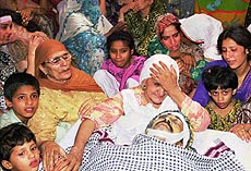 Family members of a bomb explosion victim