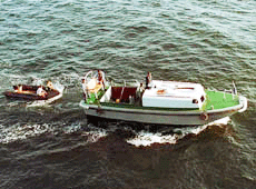 Army and Navy rescue team cruises off Pasni, Saturday, in search of bodies of Naval personnel who were boarding a Navy P-3C Orion aircraft which crashed into the Arabian Sea Friday. The aircraft crash killed all 21 military personnel on board