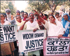 All-India Shiromani Akali Dal (Babbar) activists demonstrate in New Delhi on Sunday, demanding the arrest of miscreants of the November, 1984, riots