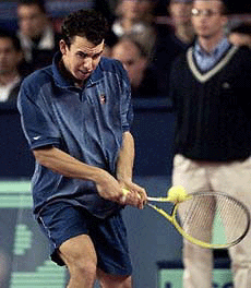 Slovakia's Dominik Hrbaty hits a backhand to Austrian Stefan Koubek during the Paris-Bercy Tennis Open on Tuesday