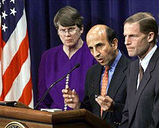Joel Klein, the assistant attorney general for the Antitrust Division, centre speaks to the press about the Microsoft ruling during a press briefing at the Justice Dept. in Washington on Friday.
