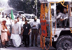 Prime Minister Atal Behari Bajpayee and Punjab Chief Minister Parkash Singh Badal flag off a fleet of trucks carrying relief material to cyclone-hit Orissa