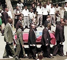 Past and present cricketers carry Malcolm Marshall's casket to St. Bartholomew's Church during his funeral service, in the parish of Christ Church, Barbados, Saturday