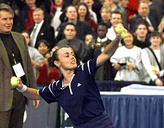 Martina HingIis of Switzerland, celebrates her 6-1, 6-2 quarterfinal victory over Mary Pierce of France, by throwing tennis balls to the crowd at the Chase Championships at Madison Square Garden in New York on Thursday