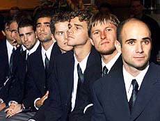 Tennis players Andre Agassi from the U.S., Yefgeni Kafelnikov of Russia, Gustavo Kuerten of Brazil, Tomas Enquist of Sweden, U.S. Pete Sampras, German Nicolas Kiefer, U.S. Todd Martin and Nicolas Lapentti of Ecuador, from right, watch the draw for the ATP tennis world championships in Hanover, northern Germany, on Monday
