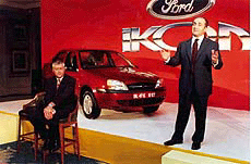 Jacoues A. Nasser, President and Chief Executive Officer of Ford Motor Company (standing) and Philip G. Spender, Managing Director of Ford Motor India at a press conference in New Delhi on Tuesday