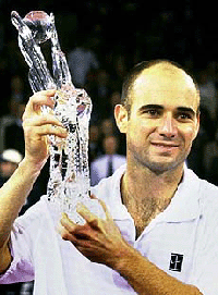 U.S. tennis player Andre Agassi holds the trophy he received for finishing the year as number one in tennis at the ATP world championship in Hanover, northern Germany on Thursday