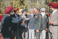 The Colonel of the Punjab Regiment, Maj-Gen S.K. Awasthy (in uniform), interacts with '71 war hero Lt-Gen Jagjit Singh Aurora (third from left) and other officers during the Punjab Regiment's annual function in Chandigarh on Sunday