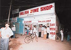 Who bothers even if it is a dry day ? Tipplers have a field day at one of the liquor vends in Nayagoan on Saturday