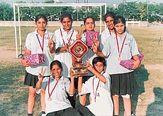 Players of Flankers BB Club displaying the trophy which they won in the women's section of the second Chandigarh Senior Ball Badminton Championship at Shivalik Public School, Sector 41, Chandigarh, on Saturday.