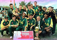 The captain of South African Cricket team Hansie Cronje (third from left sitting in foreground) with the LG Trophy and the rest of his team