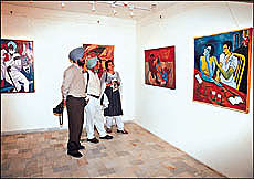 Visitors at an exhibition of paintings and sculptures by Satyajit Shergill at Art Folio, Sector 9,Chandigarh, on Monday.